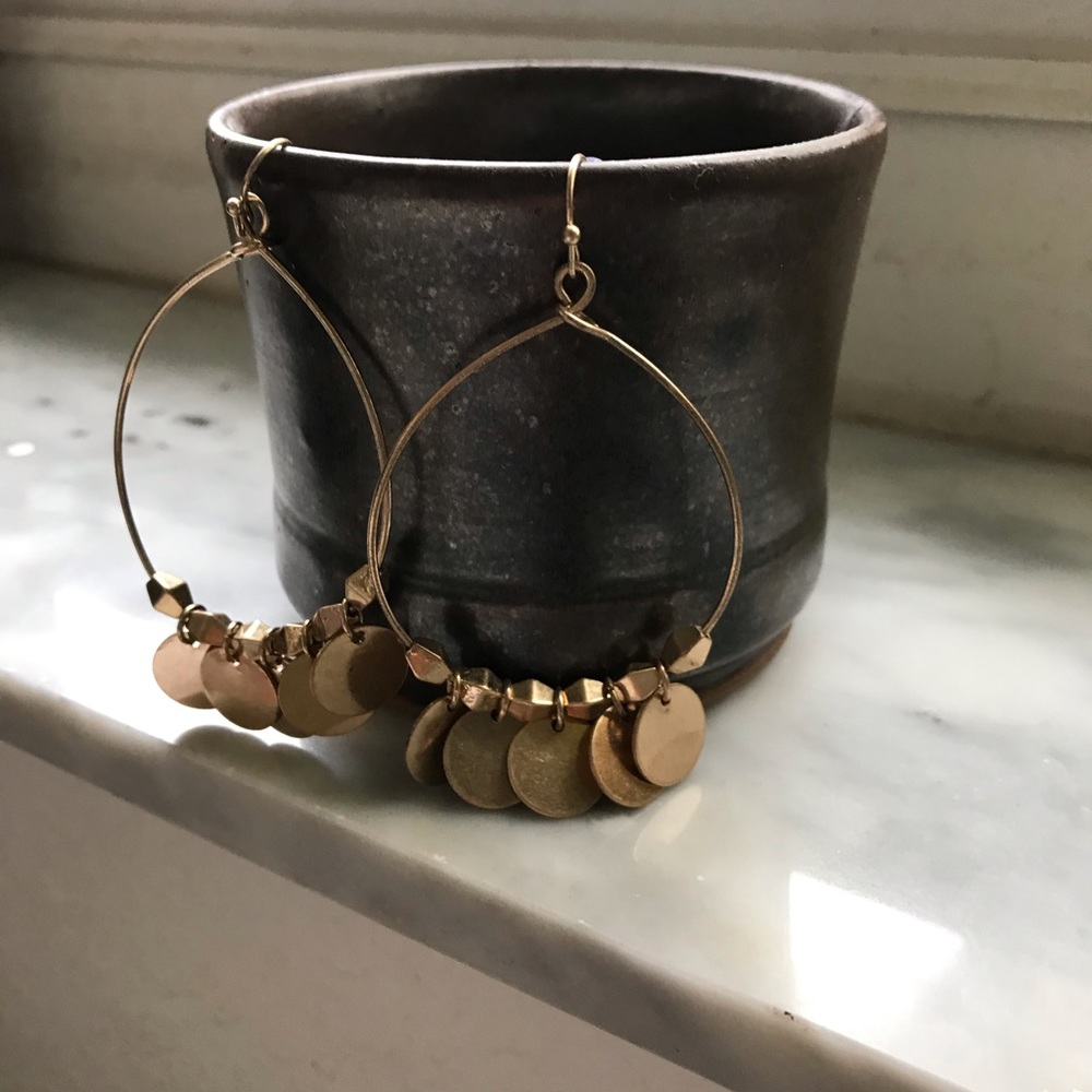 Gold tone dancing earrings